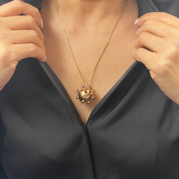 Extremely collectible mid-century 14k hollow rose gold sputnik charm with colored semi-precious stones and glass beads.