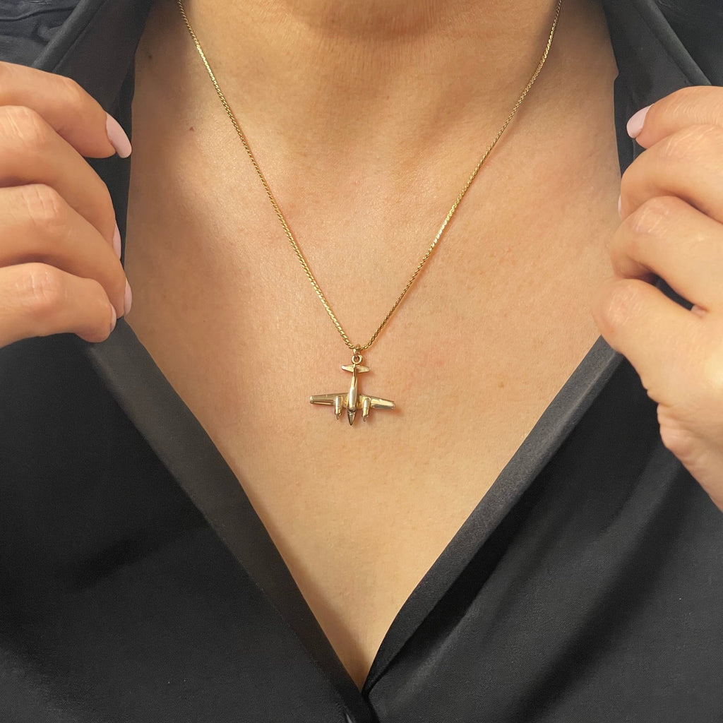 Lovely vintage solid 14k yellow gold propeller plane charm.