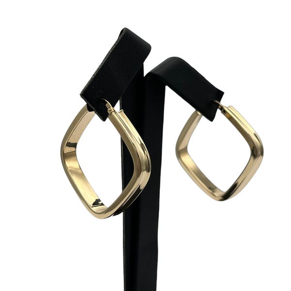 Gold hoop earrings on a white background